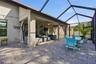 Screened lanai with pavers, plenty of space for dining and lounging