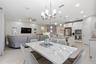 Open great room combining living, dining and kitchen in one space