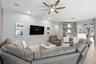 Living room with ceiling fan and 5.1 surround sound with in-ceiling speakers
