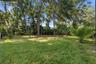 About 70-ft-deep backyard shaded by mature trees
