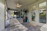 Glass French doors connect the living room to the lanai