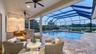Lanai overlooking pool and wraparound pond