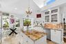 Kitchen w/ views of the pool and canal.