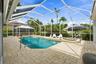 Paver pool deck with views of the canal