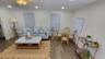 Recessed lighting, wood-finish flooring, and white walls