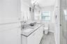 Deep vanity drawers, linen closet and 2 Robern medicine cabinets with dual interior mirrors and electrical outlets.