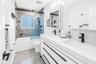 2nd bath with deep soaking tub, custom dual vanity with European style drawers, stone countertops, 2  Robern medicine cabinets, frosted glass window f