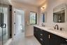 Dual vanity with integrated sinks, black fluted cabinetry, and matte black fixtures
