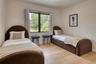 Light wood-finish flooring with a neutral wall color