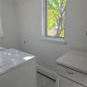 Washroom with a baseboard heating unit