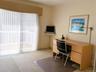 Bedroom With Walk In Closet and Access To Deck