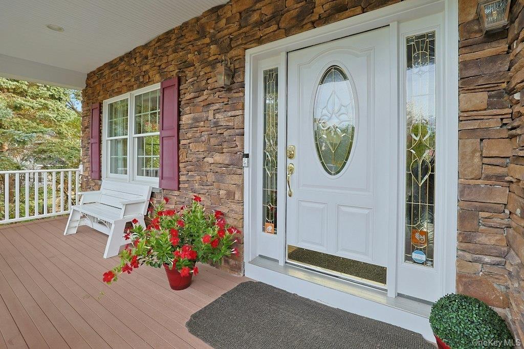 Covered Front Porch W/Colums Cultured Stone Elevation - Your Package Won't Get Wet