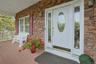 Covered Front Porch W/Colums Cultured Stone Elevation - Your Package Won't Get Wet