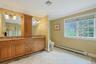 Elegant Primary Bath W/Porcelanonsa Imported Designer Tile,  Maple Cabinetry W/Glaze