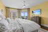 Peaceful primary suite with Gulf views and sliders opening to the private balcony.