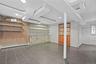 Partially Finished Lower Level With Office, Door To Yard, Laundry Room