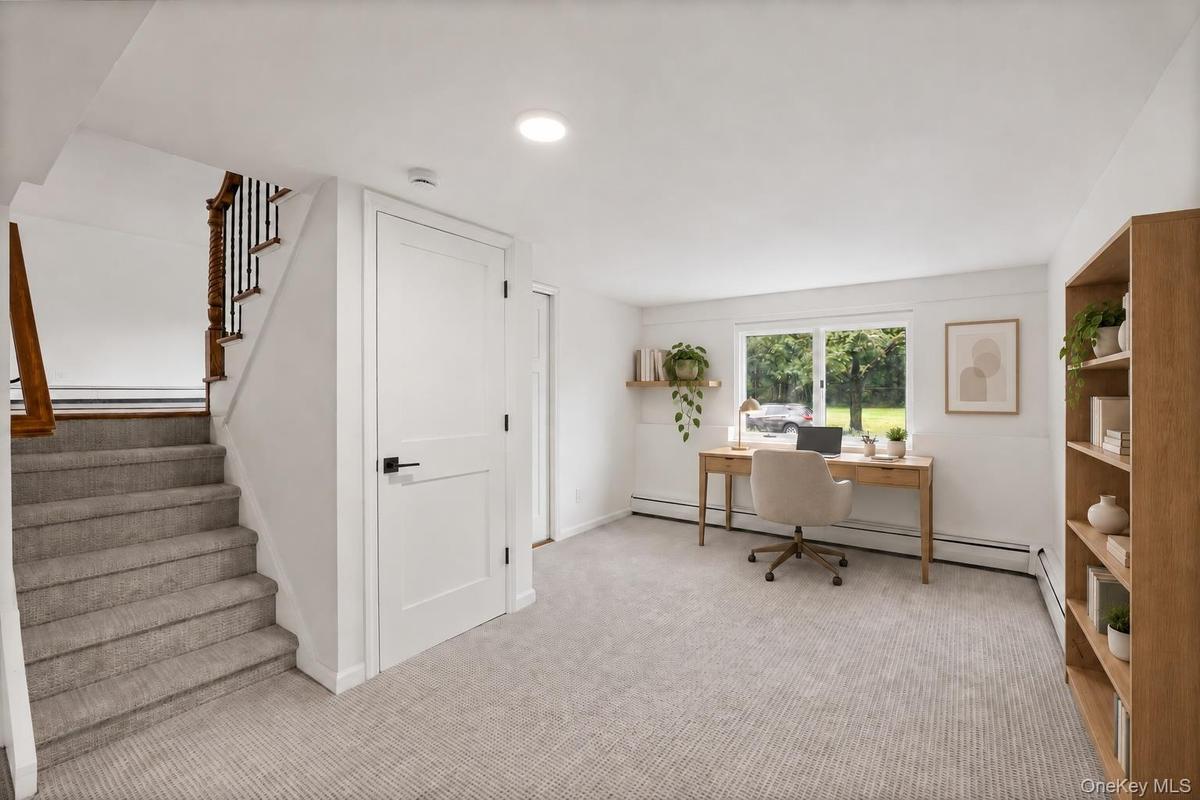 Lower Level -Stairs opening to Den -STAGED