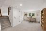 Lower Level -Stairs opening to Den -STAGED