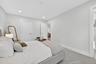 Bedroom featuring recessed lighting, ensuite bathroom, and carpet flooring