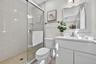 Bathroom featuring a stall shower and vanity