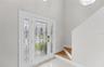 544 Lillian Dr, Madeira Beach- Front door & stairs to primary bedroom suite