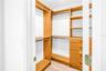 Primary Bedroom walk-in closet with California Closet