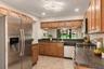 Stainless steel appliances and a practical kitchen layout.