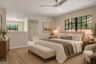 Spacious primary bedroom with room for additional seating