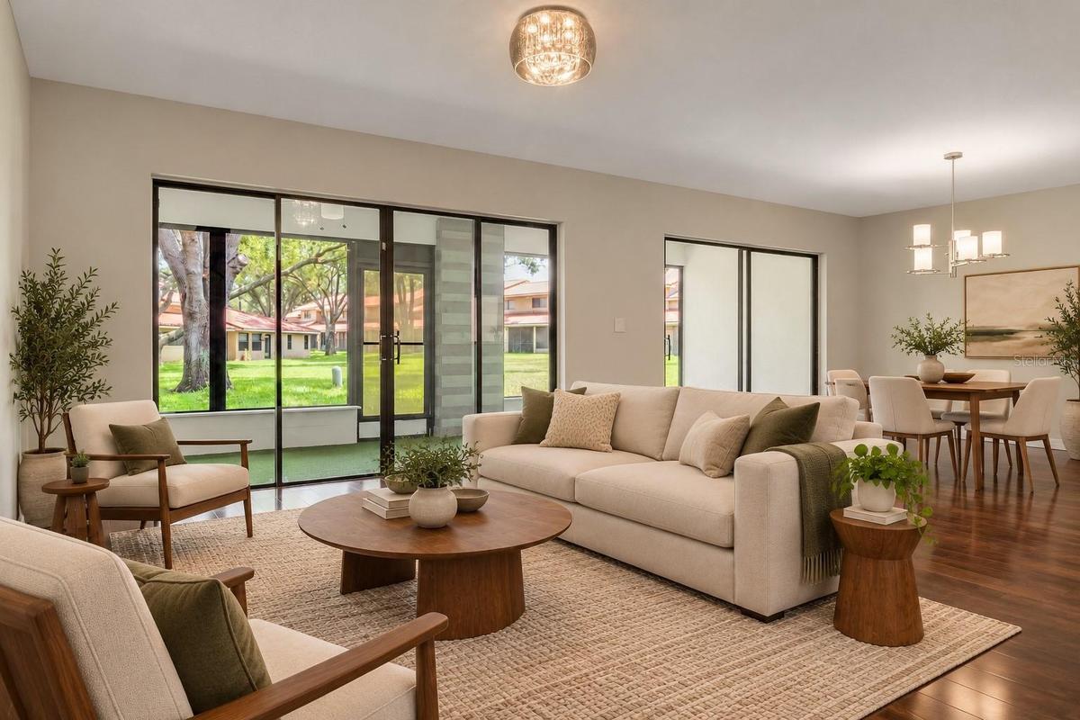 Large sliding glass doors connect the living area to the screened lanai.