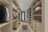 Walk-In Closet - This image has been virtually staged and does not reflect the current state of the property.