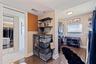 Custom designed primary walk-in closet  with view of the Gulf