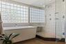 Primary en-suite with soaking tub and glass enclosed shower