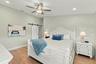 Spacious primary retreat with beautiful hardwood floors, abundant natural light, and a peaceful atmosphere.