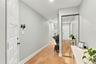 Front entryway with 3 storage closets and garage entry.