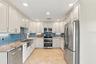 Quality finishes include a Kraus sink, California Faucets fixtures, and stainless steel appliances.