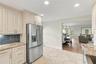 A GE Profile five-burner range with dual ovens makes this kitchen equally suited for everyday meals and entertaining.
