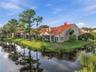 Desirable corner location surrounded by peaceful pond views, offering added privacy and a beautiful connection to nature.