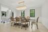 Dining room with beautiful light fixture.