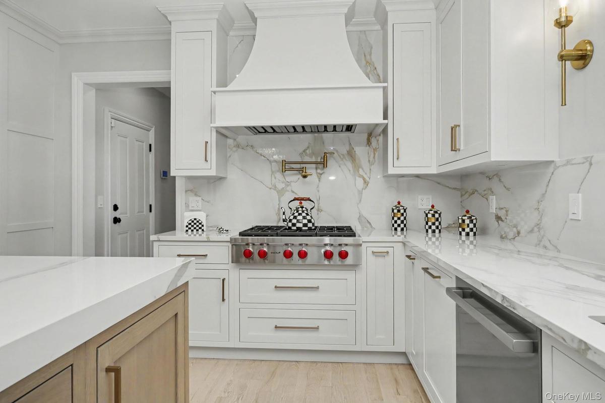 Custom design kitchen with Island and Sub-zero Refrigerator and Wolf appliances.