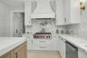 Custom design kitchen with Island and Sub-zero Refrigerator and Wolf appliances.
