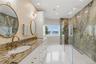 Primary designer marble bath with dual vanities