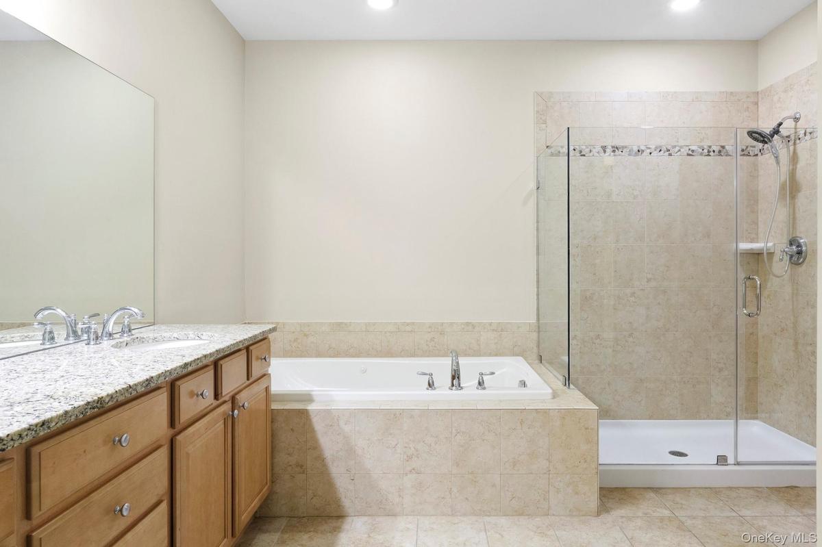 Double Vanity, Jacuzzi tub, Shower and water closet
