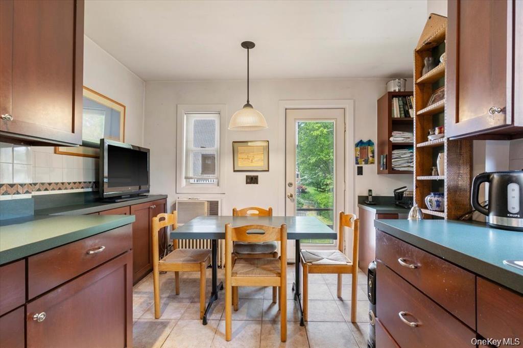 Dining area with light tile patterned floors