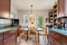 Dining area with light tile patterned floors