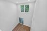 Empty room with wood finished floors and recessed lighting