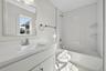 Full bathroom featuring shower / bath combination and vanity