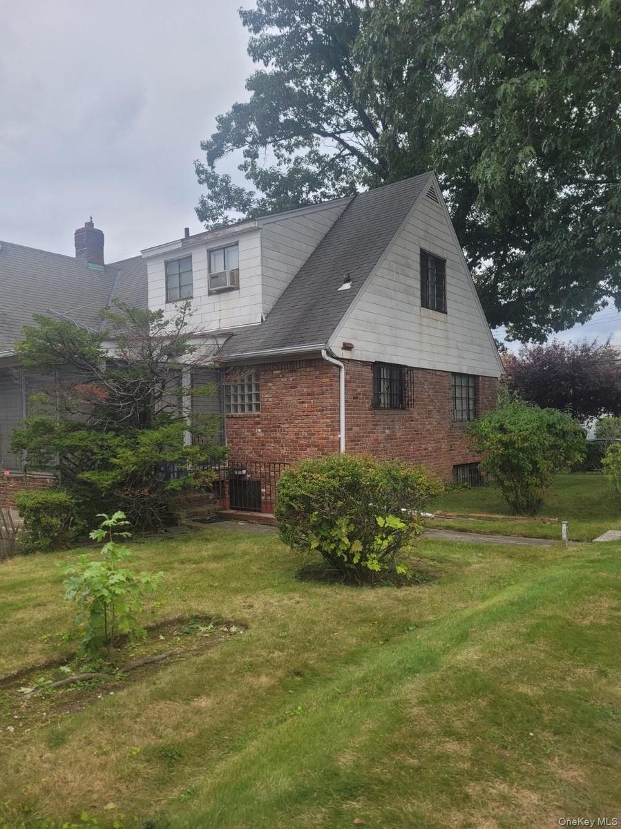Brick and siding exterior with a pitched roof