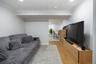 Recessed lighting illuminates the space, featuring vinyl plank flooring and a dropped ceiling