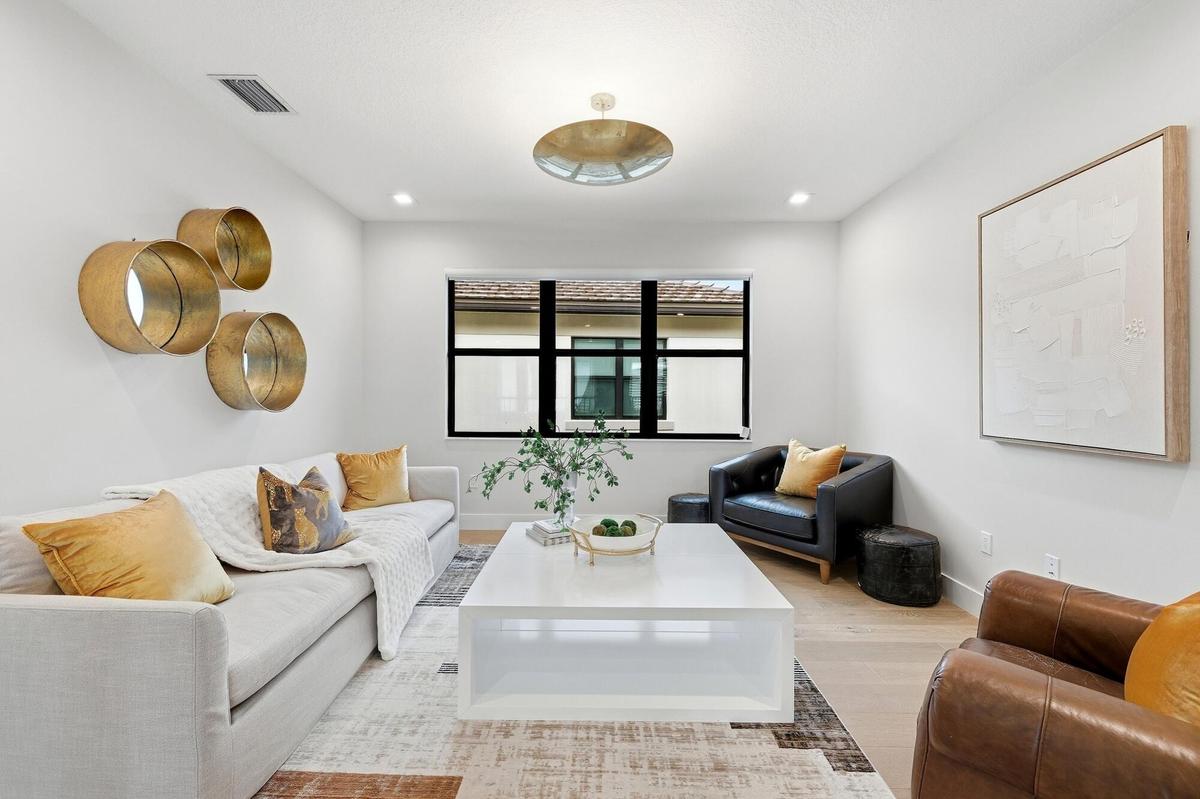 Recessed lighting, wood-finish flooring, and a contemporary ceiling fixture