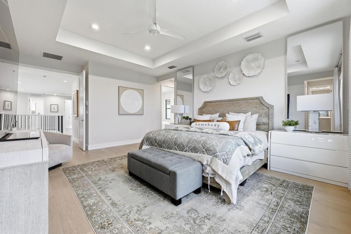 Tray ceiling with recessed lighting and a ceiling fan